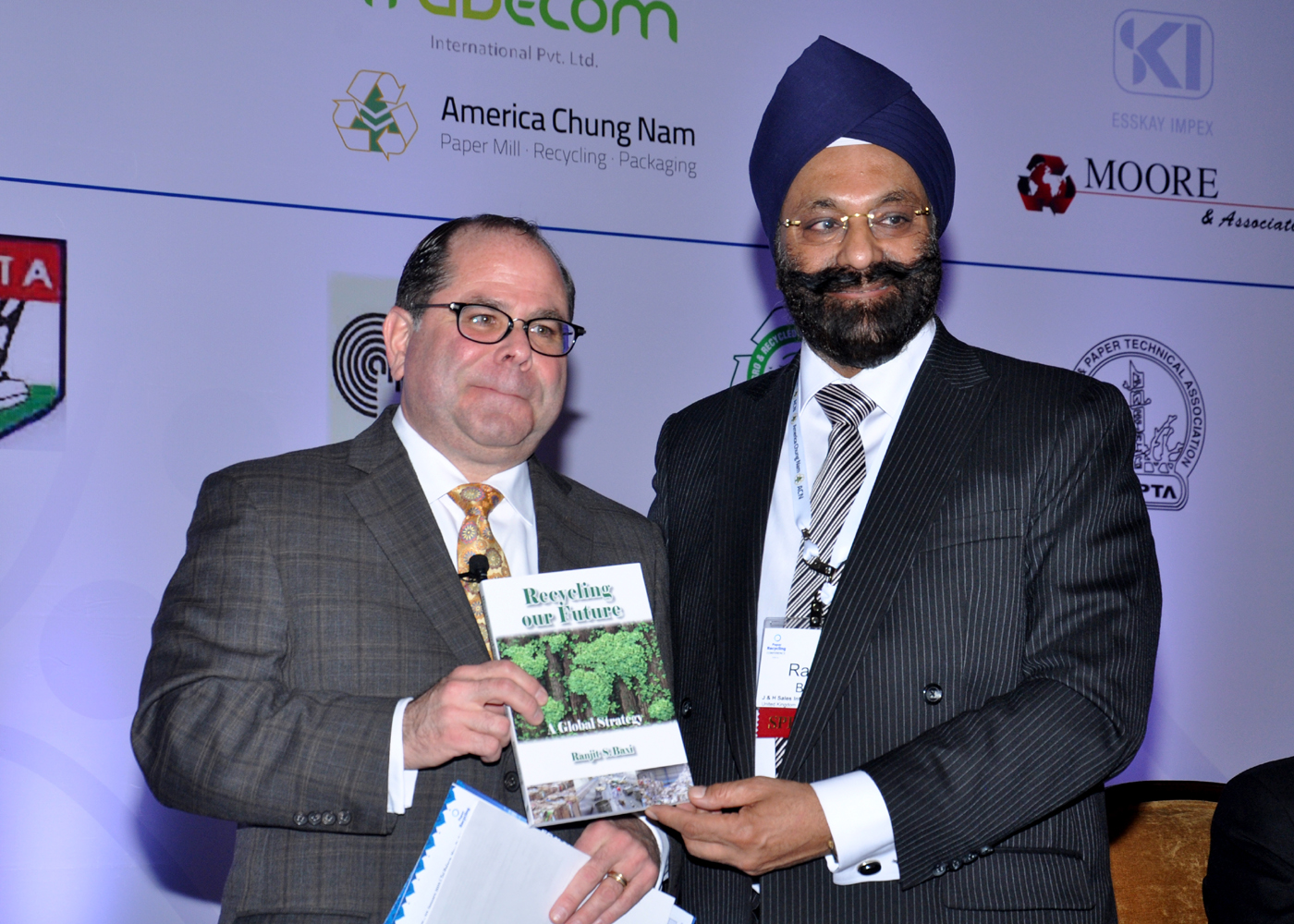 Ranjit S. Baxi presenting the publication Recycling Our Future at an industry conference